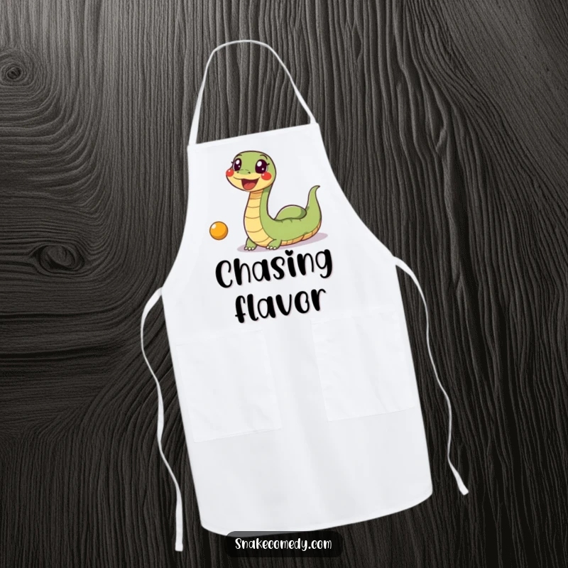 Funny Snake Ball Apron: An excited, wiggly snake is humorously shown chasing after a bouncing ball while cooking.