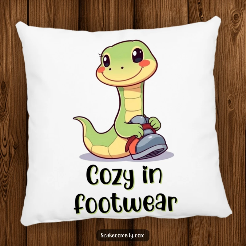 Funny pillow featuring a snake with a wide, happy smile playfully trying on a shoe, designed for comfort and amusement.