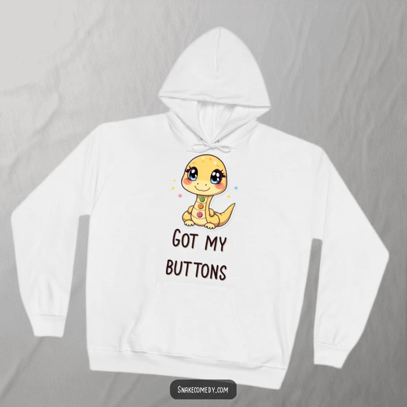 Funny hoodie illustrating a snake with glittering eyes, effortlessly juggling three shiny buttons in a mesmerizing display.