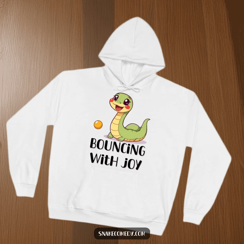 Funny Snake Ball Hoodie: A depiction of an excited, wiggly snake gleefully chasing a bouncing ball, designed for cozy fun.