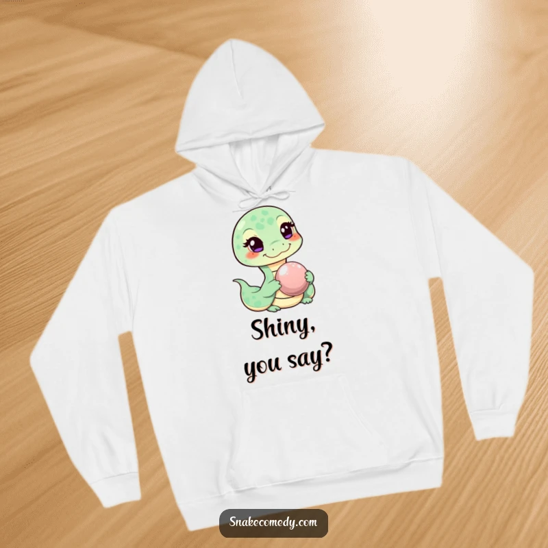 Funny hoodie depicting a sly, winking snake character extending a shiny pebble, a humorous and charming gesture.