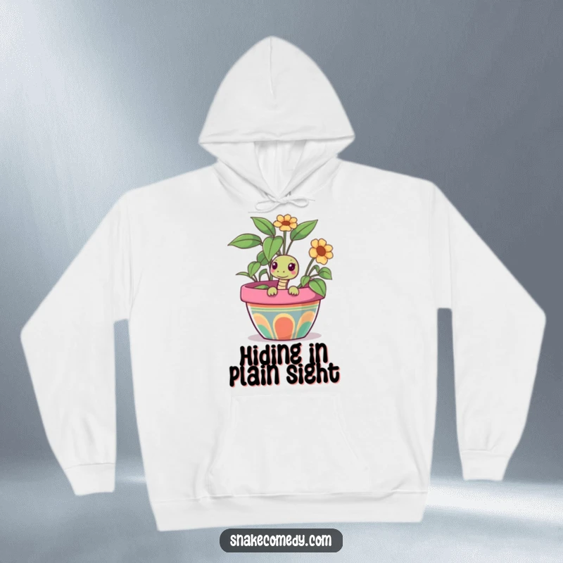 Funny snake hoodie featuring a snake curiously peeking out from a large, colorful flower pot, offering warm and whimsical comfort.