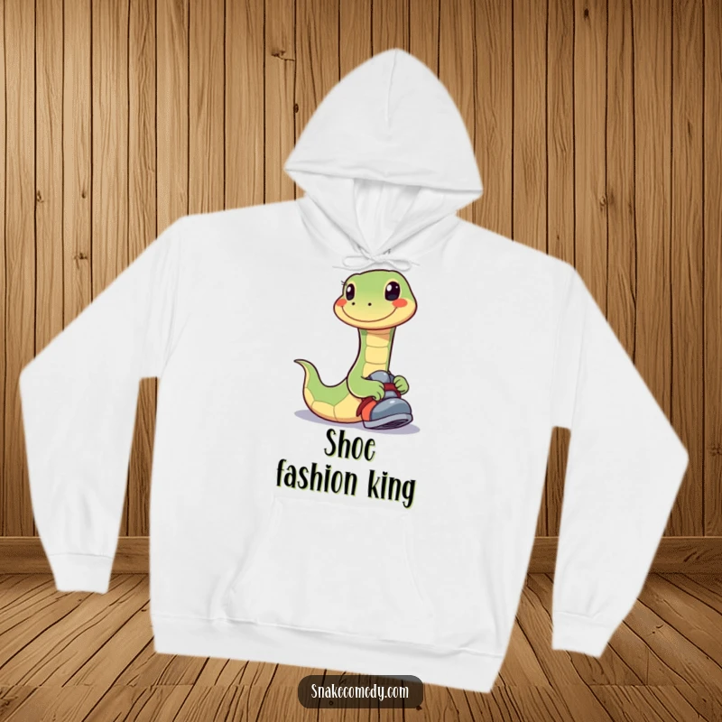 Funny hoodie featuring a snake with a wide, joyful smile playfully trying on a shoe, perfect for cozy happiness.