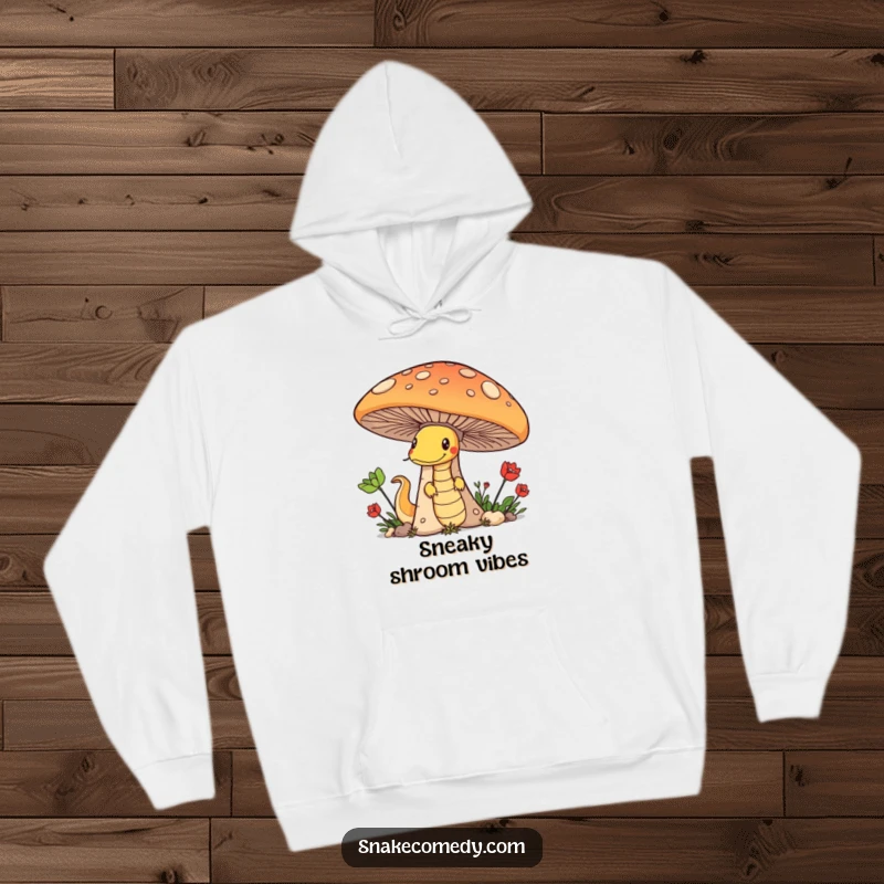 Funny hoodie depicting a sly snake peeking from behind a giant mushroom, radiating pure mischief and playful energy.