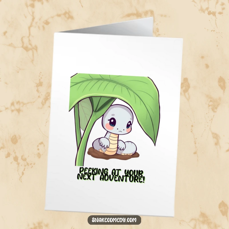 Funny Free Printable Birthday Card: Snake character curiously peeking from behind a large green leaf, a fun downloadable.