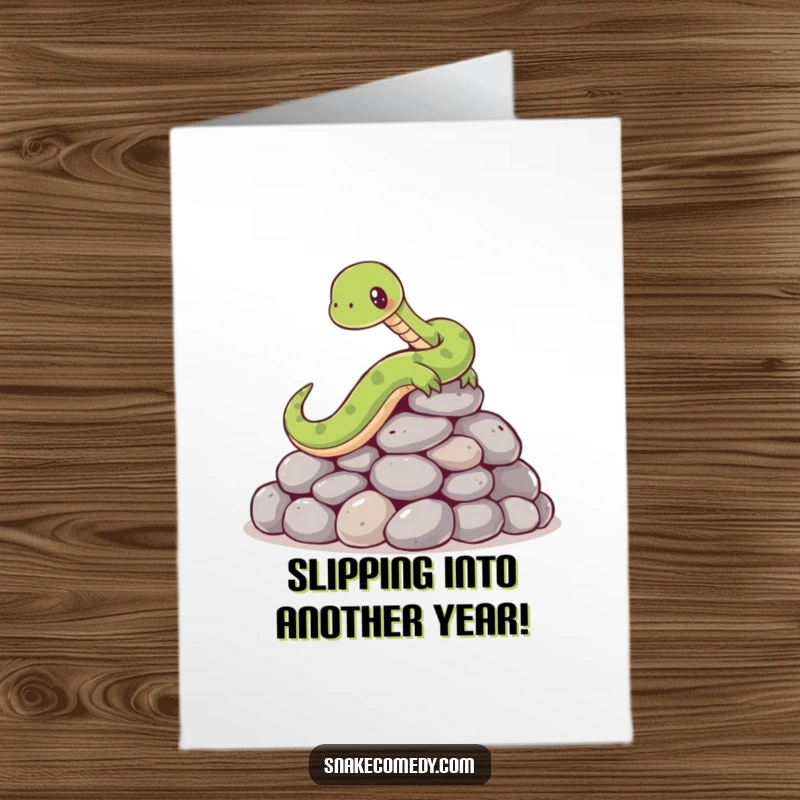 Funny Free Printable Birthday Card: A cartoon snake comically slips and slides on a pile of smooth stones.