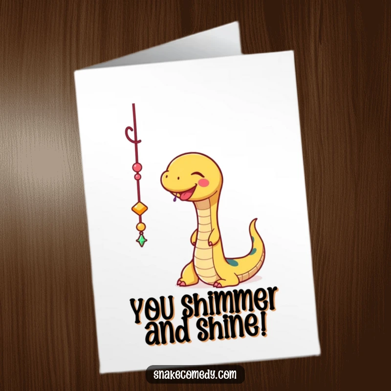 Funny Free Printable Congrats Card: A snake joyfully bats at a dangling sparkly charm, symbolizing a brilliant and successful outcome.