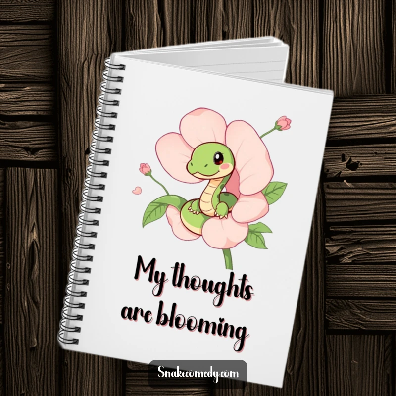 Funny notebook with a cute snake peeking out from a blooming flower on the cover, inspiring imaginative writing and creativity.