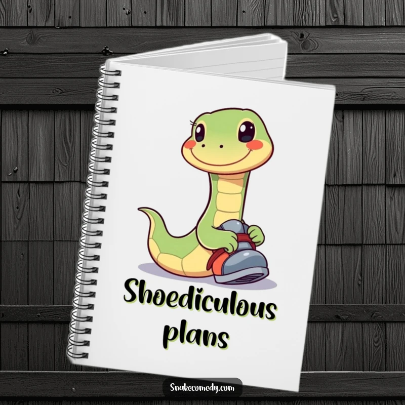 Funny notebook cover featuring a happy snake with a wide smile playfully trying on a shoe, perfect for jotting down happy ideas.