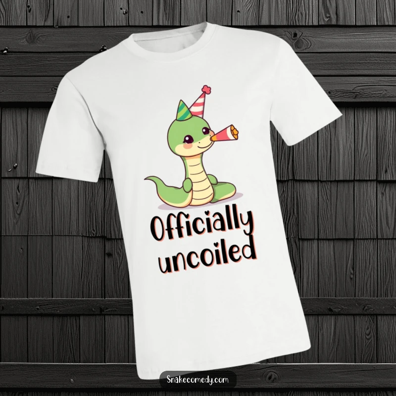 Funny snake wearing a party hat, blowing a cheerful party horn on a t-shirt, ideal for festive occasions and humor lovers.