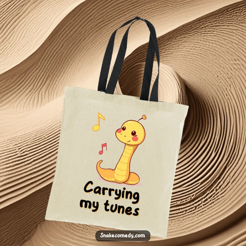 Funny tote bag showcasing a snake playfully bopping a floating musical note, perfect for carrying your rhythm.
